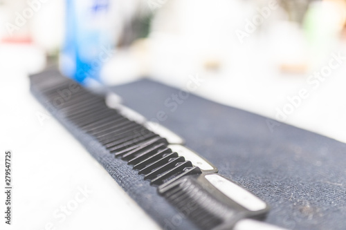 Black hair clipper comb hairdresser tool. © zphoto83
