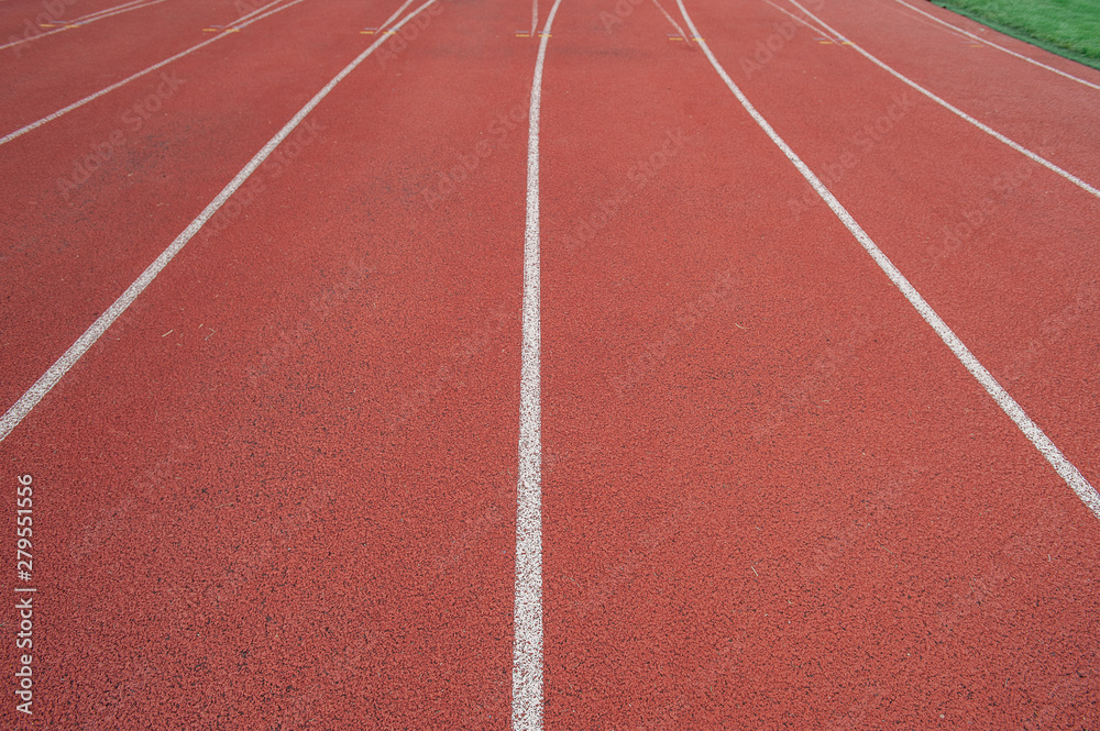 Sport. A red treadmill at the stadium. Copy space