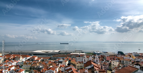View of the old town, the sea and the ship on a sunny day, Lisbon, Portugal
