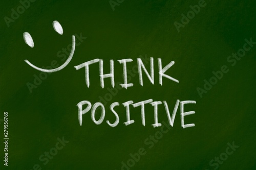 Positive thinking background concept on green chalkboard