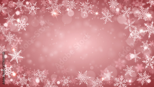 Christmas background of complex blurred and clear falling snowflakes in peach colors with bokeh effect