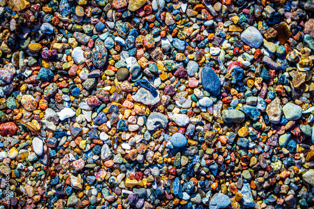 colorful pebbles on the beach colorful pebbles on the beach