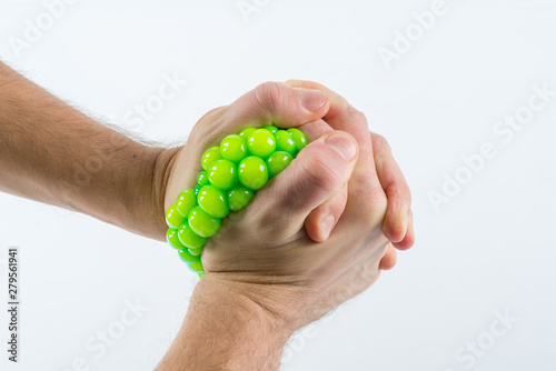 Male hand squeezing stress ball