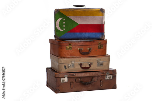 Comoros, Comorian travel concept. Group of vintage suitcases isolated on white background.