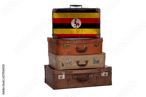 Uganda, Ugandan travel concept. Group of vintage suitcases isolated on white background.