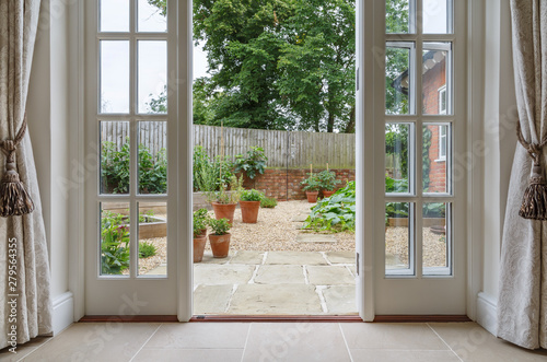 Obraz na plátně French doors leading to kitchen garden