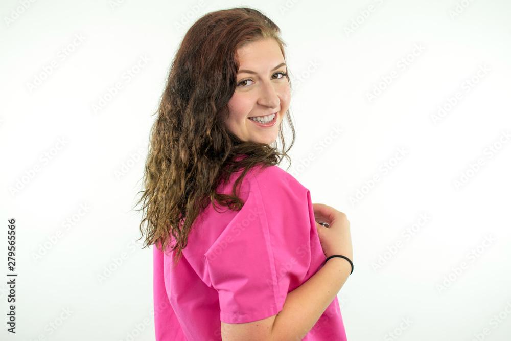 Pretty Young Girl Wearing Pink Scrubs Holding A Stethoscope Pretty Young Girl Wearing Pink Scrubs Holding A Stethoscope