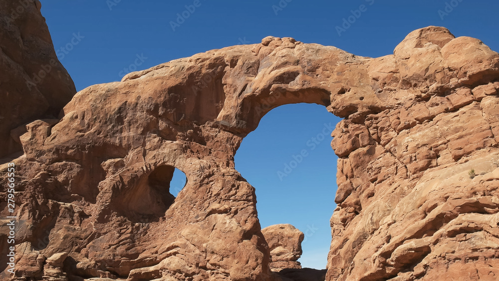 low angle shot of turret arch in utah