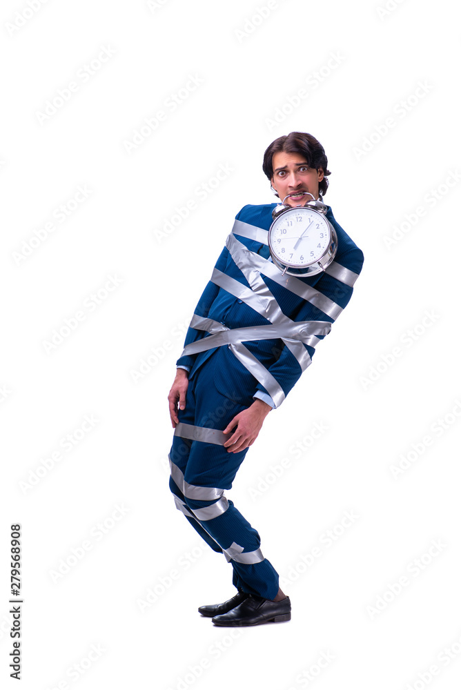 Young tied employee in time management concept Young tied employee in time management concept