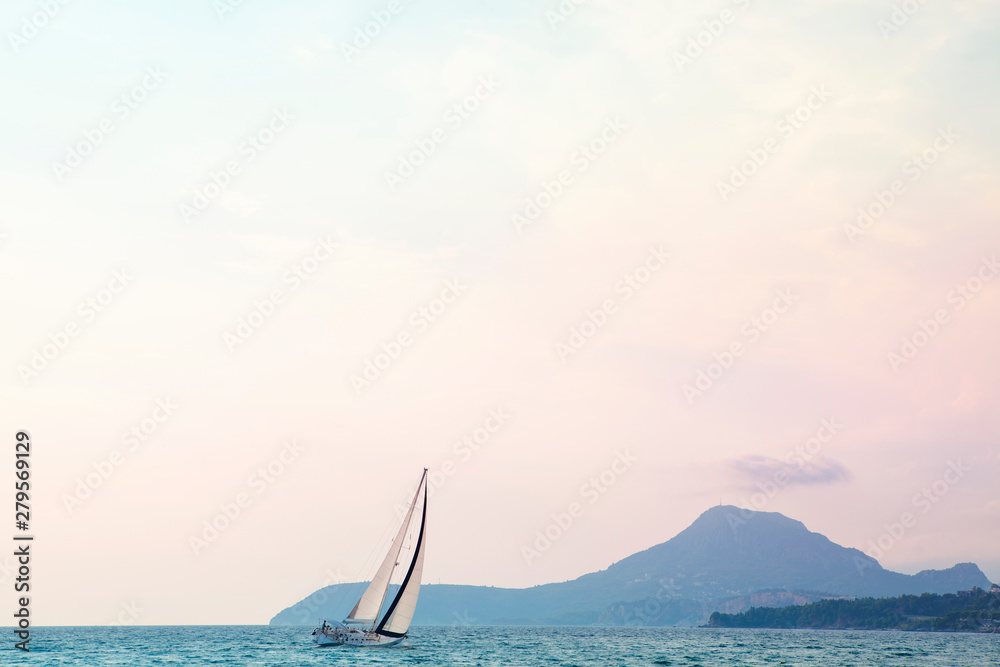 Obraz premium yacht in the bay in the sunny day