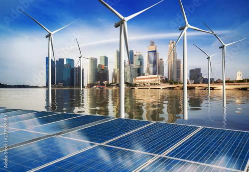 Photography Solar energy panel photovoltaic cell and wind turbine farm power generator in nature landscape for production of renewable green energy is friendly industry