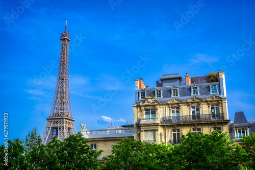 Fototapeta Naklejka Na Ścianę i Meble -  A view of the Eiffel Tower from the streets of Paris, France.