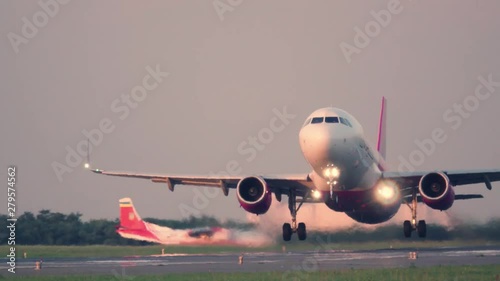 Airplane taking off. Aircraft takes off at sunset photo