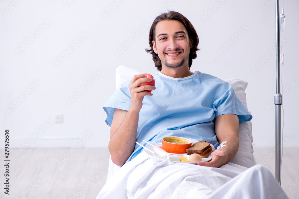 Male patient eating food in the hospital Male patient eating food in the hospital