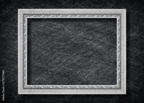 Old Gray picture frame on black stone background