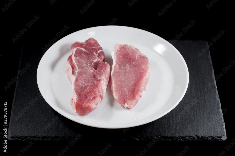 Cooking two steaks close-up. Sliced meat fillet Cooking two steaks close-up. Sliced meat fillet