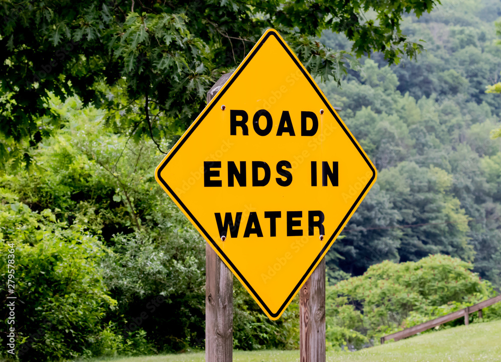 road ends in water yellow caution sign