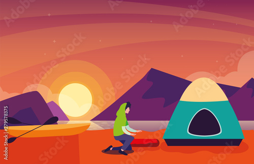 man with camping tent on the river shore