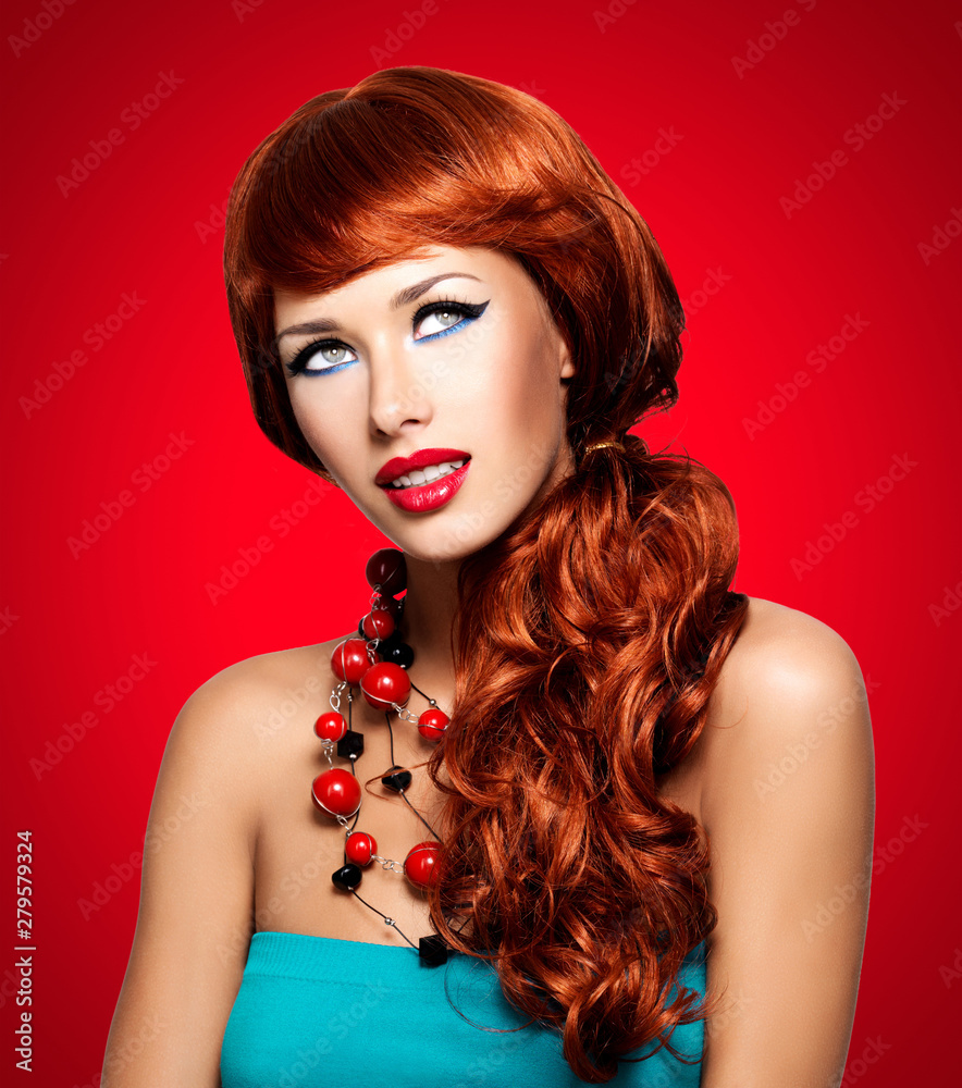 Fototapeta premium Beautiful sensual woman with long red hairs.