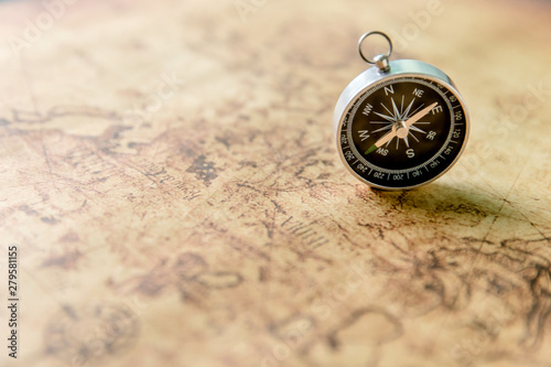 Obraz na plátne Old compass on vintage map. Retro stale.