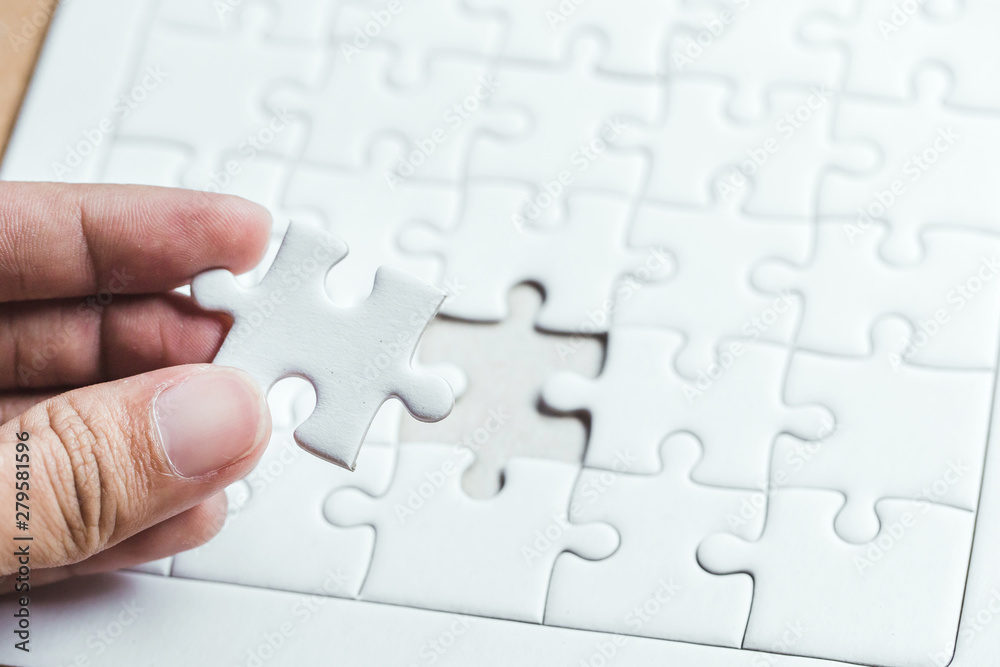 Pieces of jigsaw on palm,Pieces of jigsaw puzzle in man's hands Pieces of jigsaw on palm,Pieces of jigsaw puzzle in man's hands