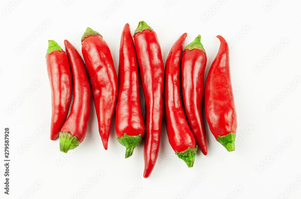 chili peppers row on white background