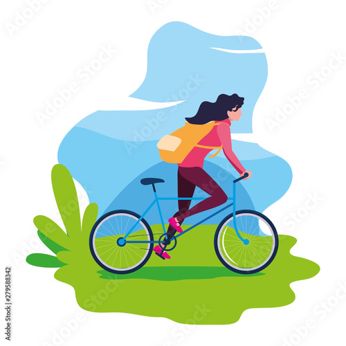 traveler woman with bag riding bicycle