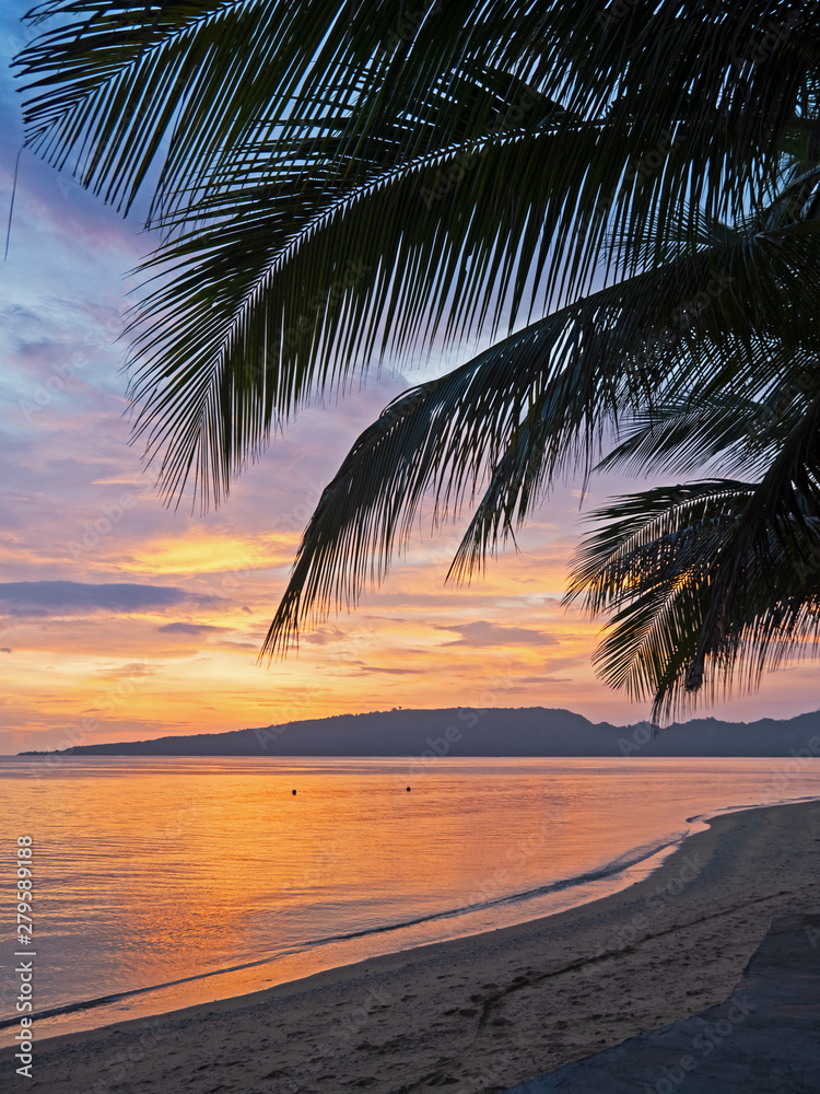 Outdoor photography of a sunset on the tropical beach.