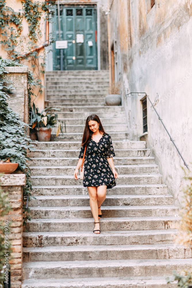 Travel blogger and sightseeing. Portraits of a beautiful girl on the streets of Rome. Travel blogger and sightseeing. Portraits of a beautiful girl on the streets of Rome.