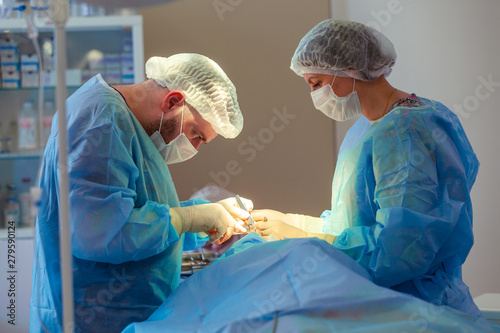 Medical Team Performing Surgical Operation in Modern Operating Room. Rhinoplasty