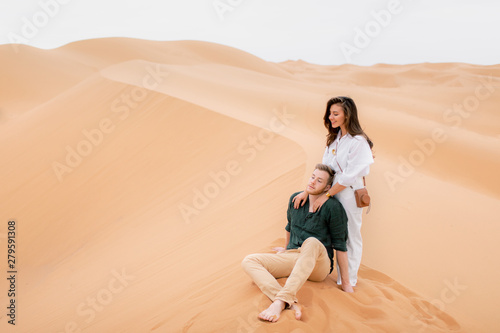 Loving couple in Sahara Desert. © Anastasiia Krivenok