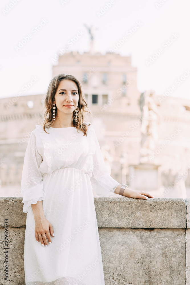 Wedding photo shoot of the bride in Italy. Portrait of a stylish girl on the streets of Rome.