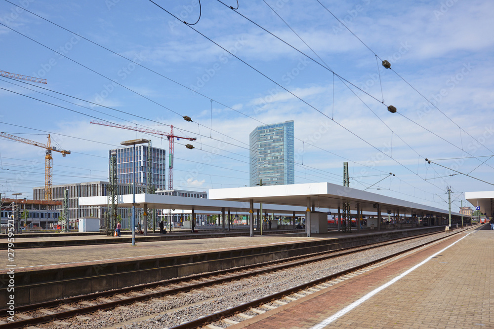 Mannheim, Germany - July 2019: Tracks and platforms of Mannheim main train station on summer day with blue sky