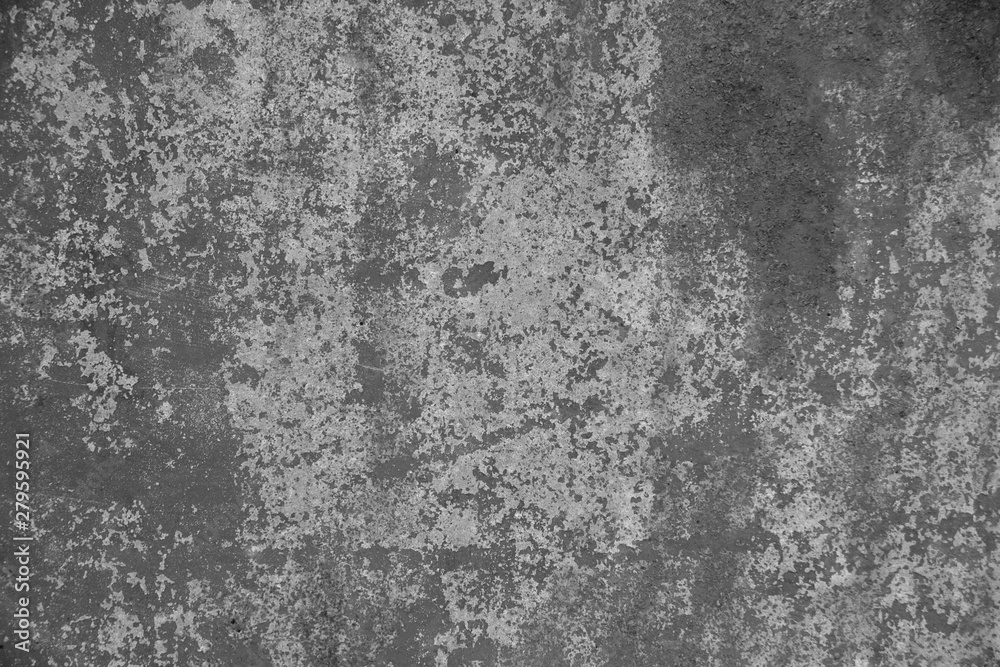 The texture of an old rusty metal wall. Shot in gray tones.