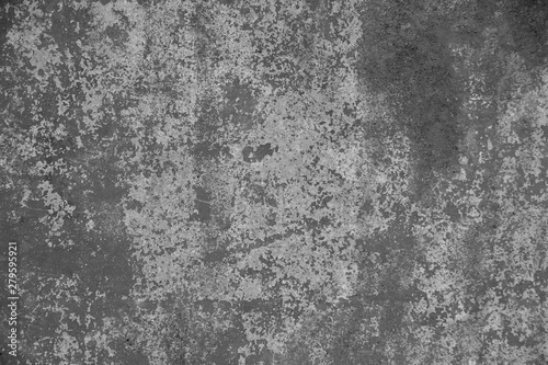 The texture of an old rusty metal wall. Shot in gray tones.