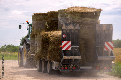 Agricultural old machinery transporting dry hay bales.