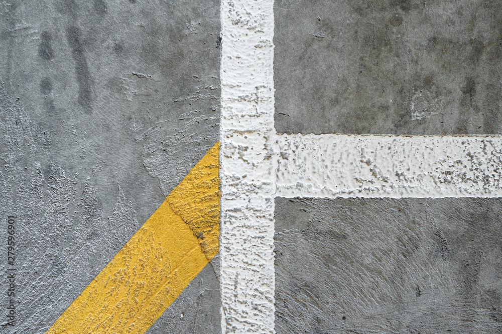 Fototapeta premium Concrete texture with yellow painted line. Background graphic asset.