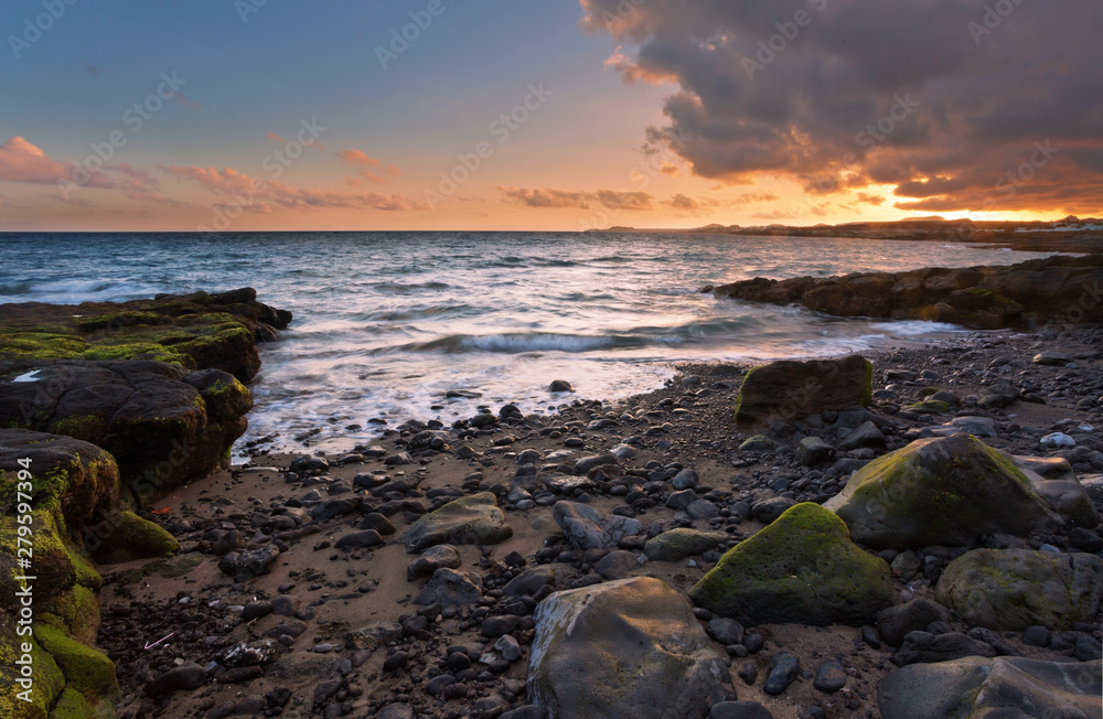 rocks and sea in sunset time
