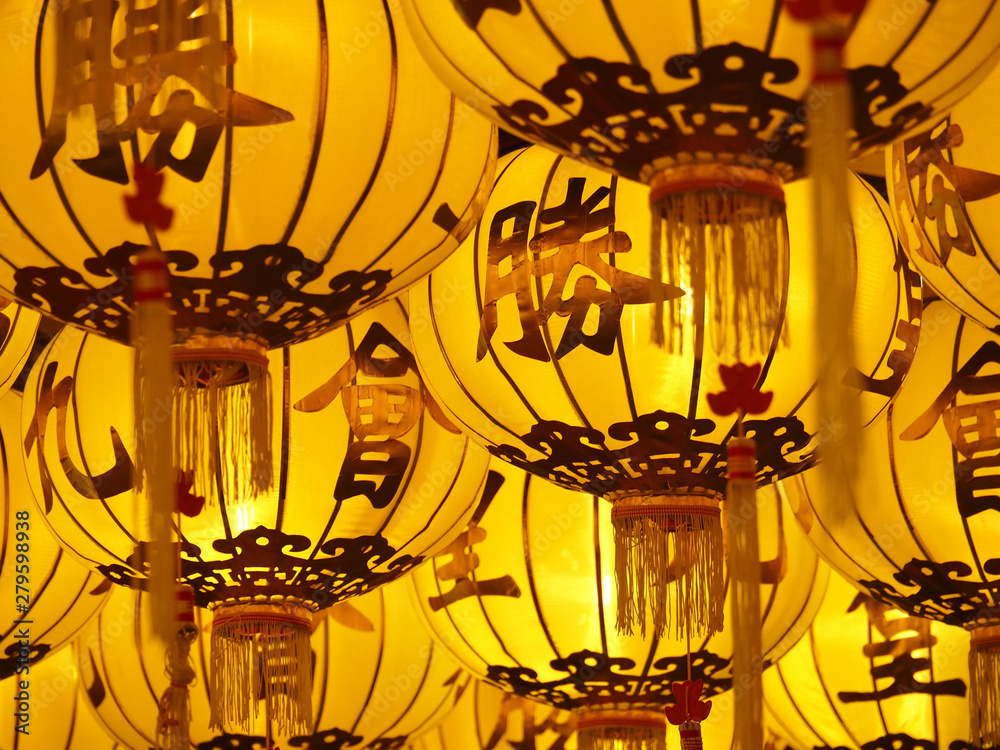 Golden Chinese lanterns,selective focus,Chinese characters refer to vegetarian festivals.- Image Golden Chinese lanterns,selective focus,Chinese characters refer to vegetarian festivals.- Image