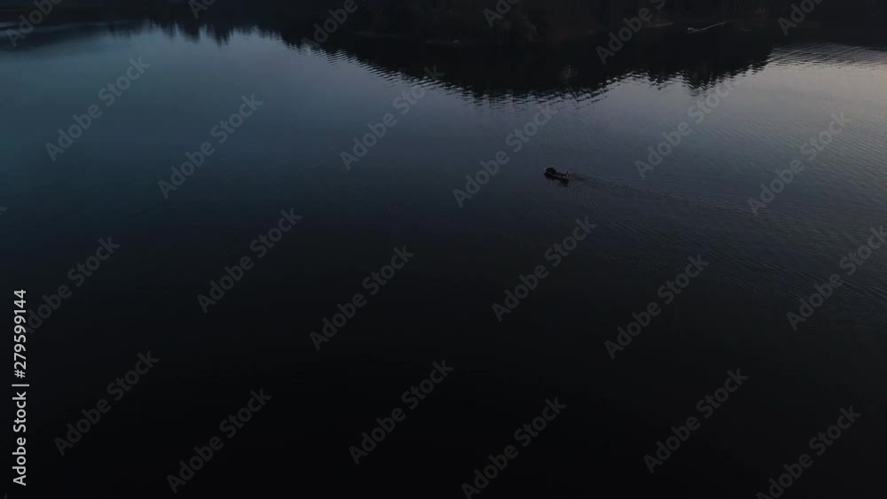 Boat at dusk on Thac Ba Lake, Vietnam, aerial view reveal Boat at dusk on Thac Ba Lake, Vietnam, aerial view reveal