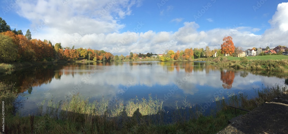 beautiful autumn landscape Pond in autumn, yellow leaves, reflection