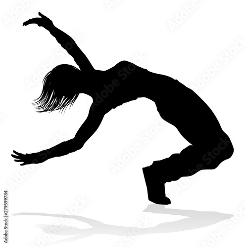 A woman street dance hip hop dancer in silhouette