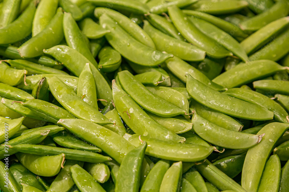 A full frame photograph of sugar snap peas for sale on a market stall