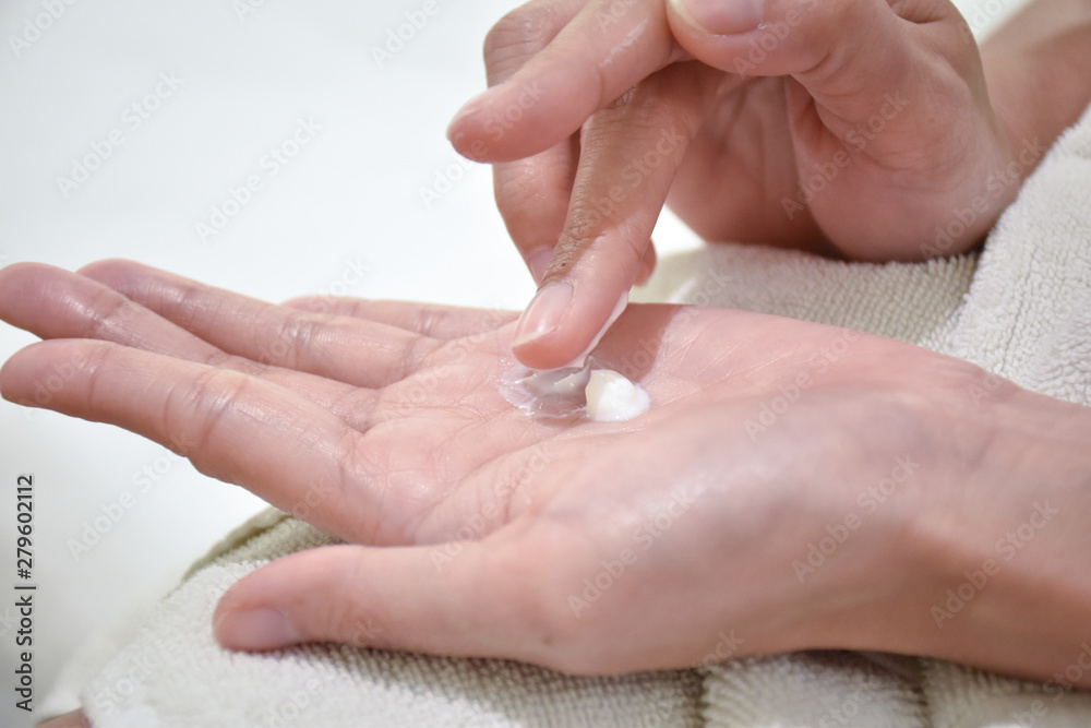 Woman applying moisturizing cream/lotion on hands, beauty concept. Woman applying moisturizing cream/lotion on hands, beauty concept.