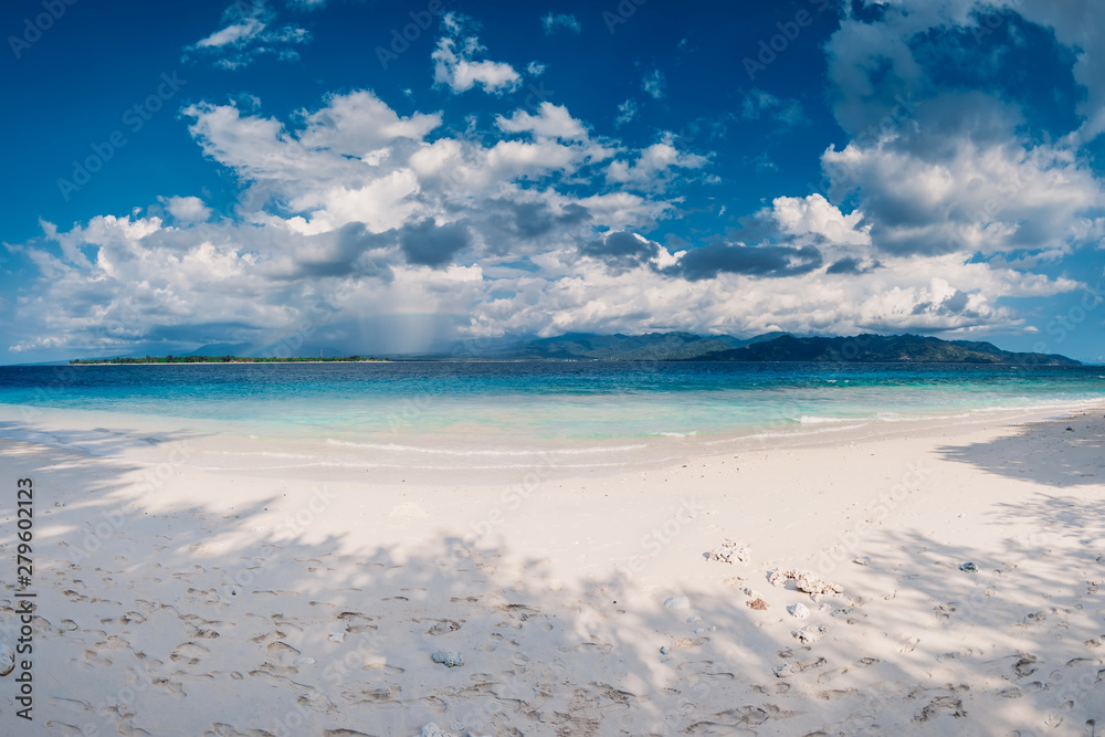Paradise beach with blue ocean in tropical island Paradise beach with blue ocean in tropical island
