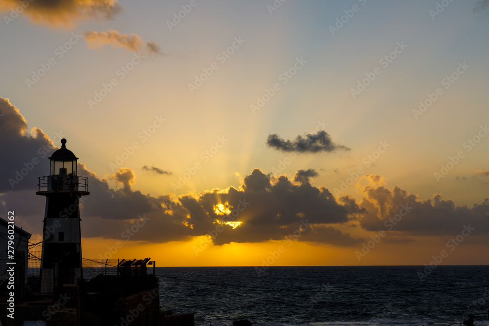 Lighthouse at sunset at crusader town Akko in Israel 