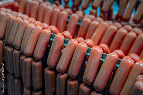 Raw sausages links on racks