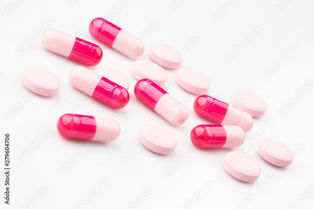 Pharmacy theme. Pink capsules and antibiotic pills. Pharmacy theme. Pink capsules and antibiotic pills.
