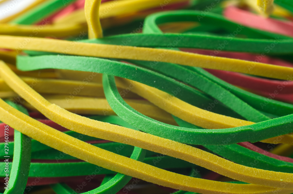 heap of colorful rubber bands in green and yellow