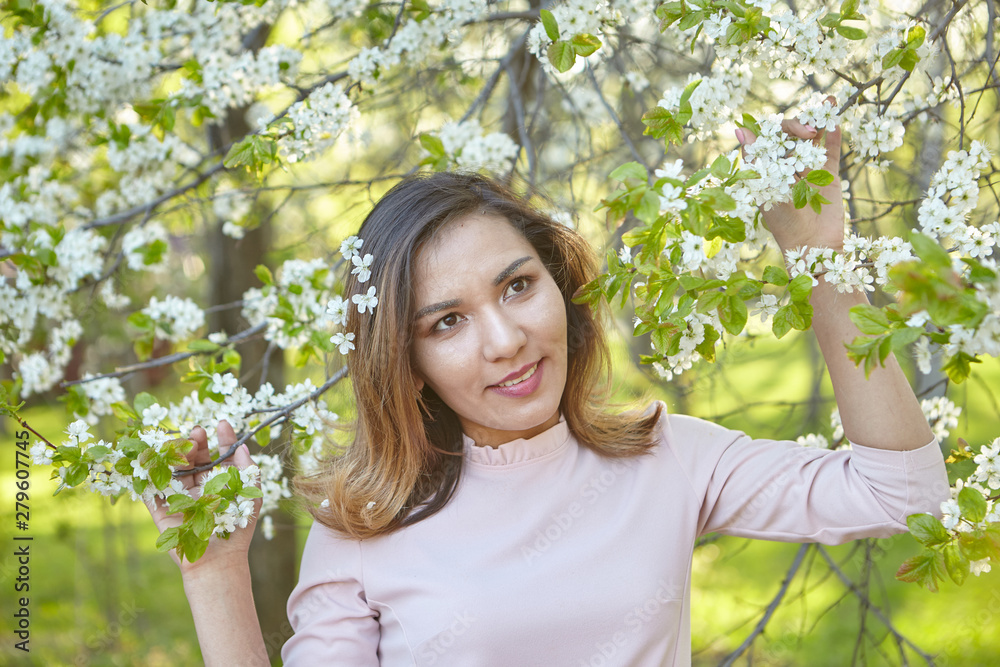 girl with flowers. gorgeous model in the spring garden. the girl near the tree in the spring. girl with flowers. gorgeous model in the spring garden. the girl near the tree in the spring.